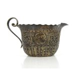 Silver cream jug with repeating floral scrolling motif and crimped rim, by JD&S Sheffield