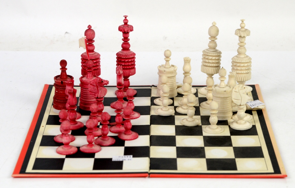 Red and white chess set and a set of weighing scales