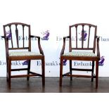 Pair of 19th century mahogany open armchairs, with drop-in seats on square tapering supports.