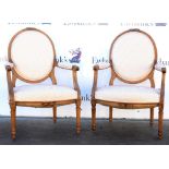 Pair of 20th century French oak salon armchairs with reeded legs. One with top rail loose at the