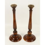 Pair of turned mahogany candlesticks, H38cm