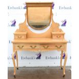 Painted pine dressing table on cabriole legs and castors. 115 W x 56D.