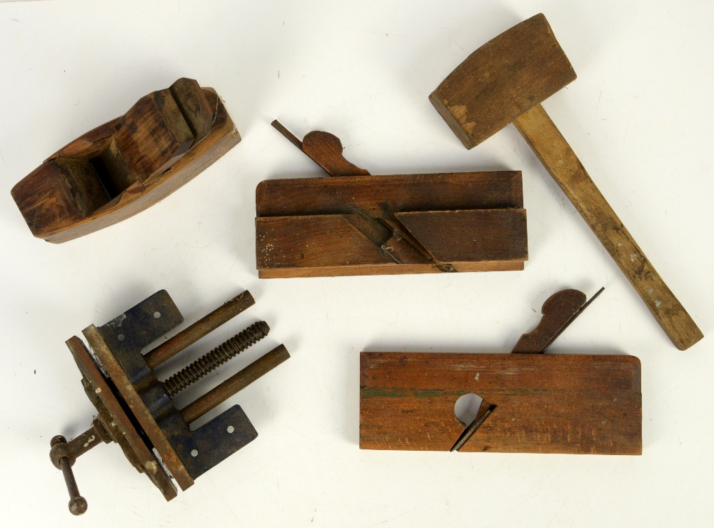 Collection of wooden tools in blue metal tool box