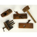 Collection of wooden tools in blue metal tool box