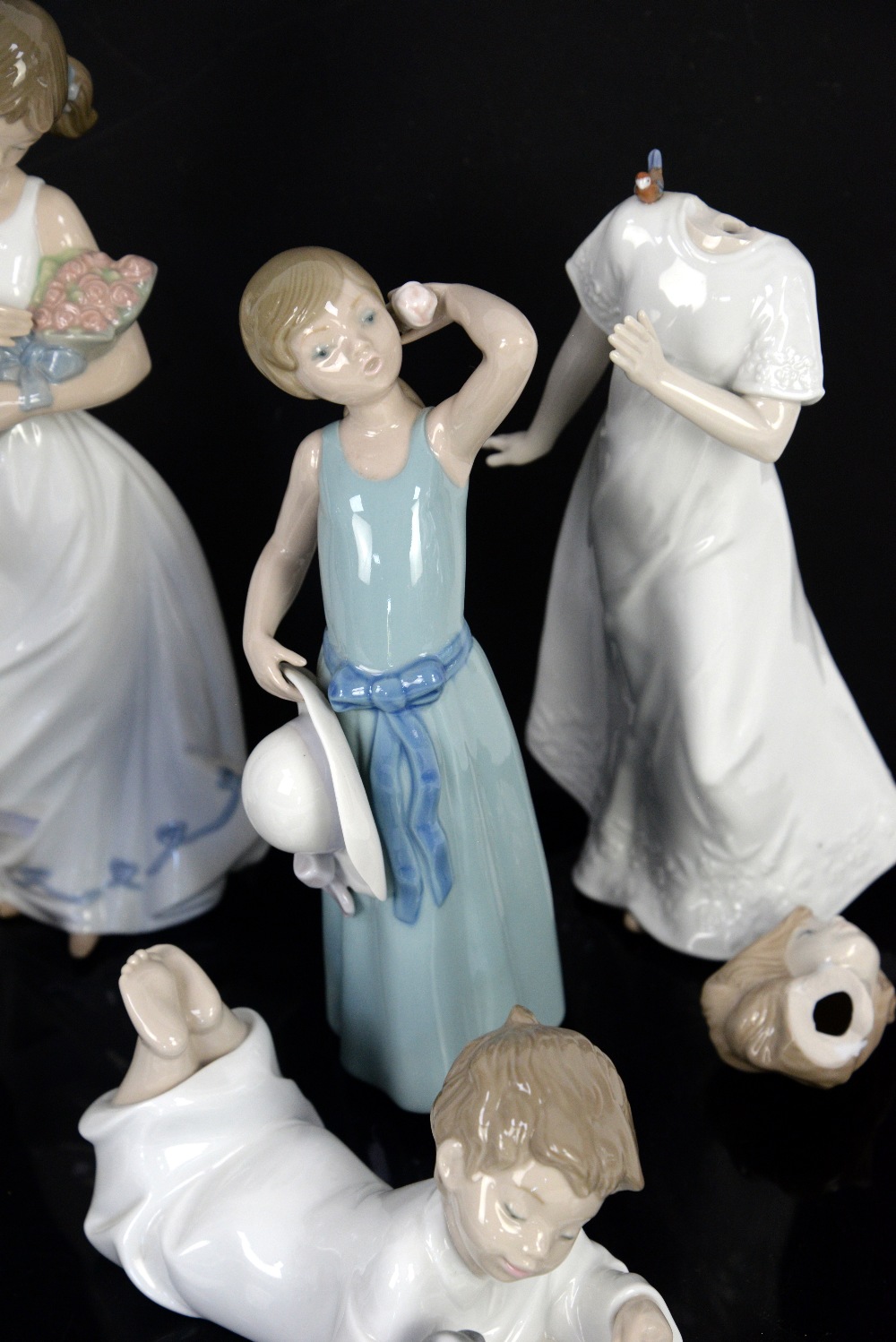 Llladro figure of a girl holding her bonnet and three Nao figures of children and Doulton figure - Image 3 of 6