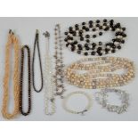 Group of freshwater pearl jewellery, including two opera length necklaces, one strung with white and