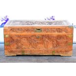 Oriental carved wood trunk, with figural decoration,