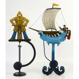 Metal painted balance sculptures relating to the sea comprising Fisherman helming, another of a