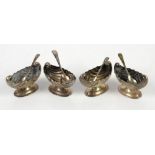 Cased set of four silver Navette form pedestal salts by Florence Warden, Chester 1897