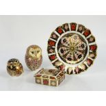Royal Crown Derby Imari pattern plate with fluted edge, box and cover, and two Owl paperweights