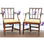 Pair of 19th century mahogany armchairs with tapestry drop-in seats and square tapering supports.