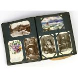 Album of postcards and greetings cards, to include Mabel Lucie Atwell, Bamforth Taylor Tot, Felix