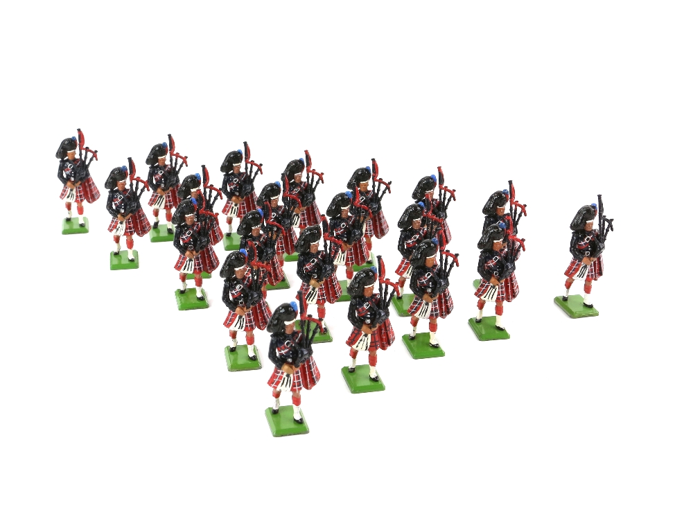 Twenty-one 1980's Britians Highland Regiment bagpipers, (loose),