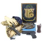Collection of props and accessories including vintage 1930's Tarzan costumes, Stunt SIG pistol,