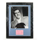 George Cole autograph mounted underneath a black and white photo of Cole in the guise of “Flash