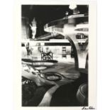 James Bond - Large black and white still showing the set of a a James Bond film, signed to the