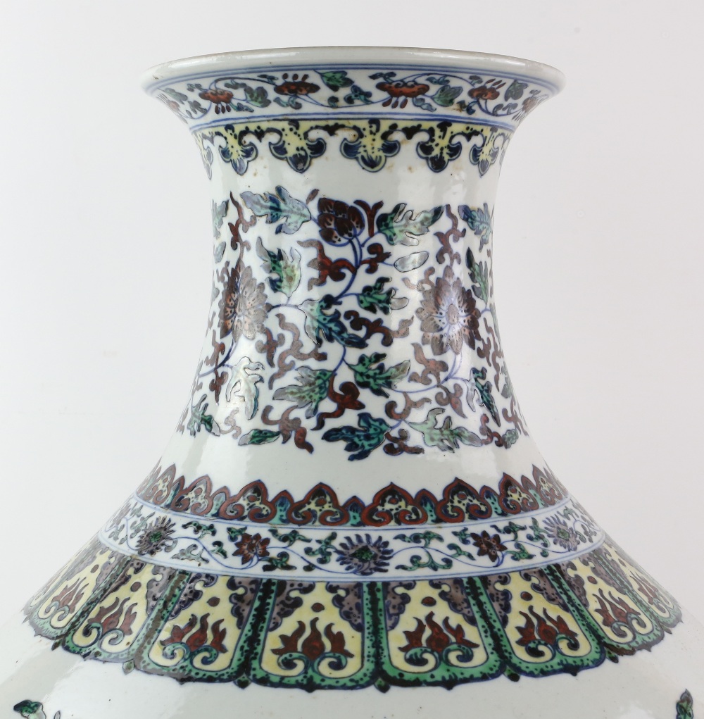 A large doucai style vase with trumpet neck, decorated with floral designs beneath a band of - Image 9 of 11