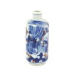 A Chinese snuff bottle of cylindrical form decorated in underglaze blue and yu li hung with a