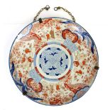 Large Japanese charger decorated in the Imari palette with figures, flower and foliage, 55.5cm