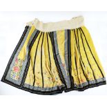 An Imperial-Yellow ground lady's skirt with vertical black lines , decorated with butterflies and