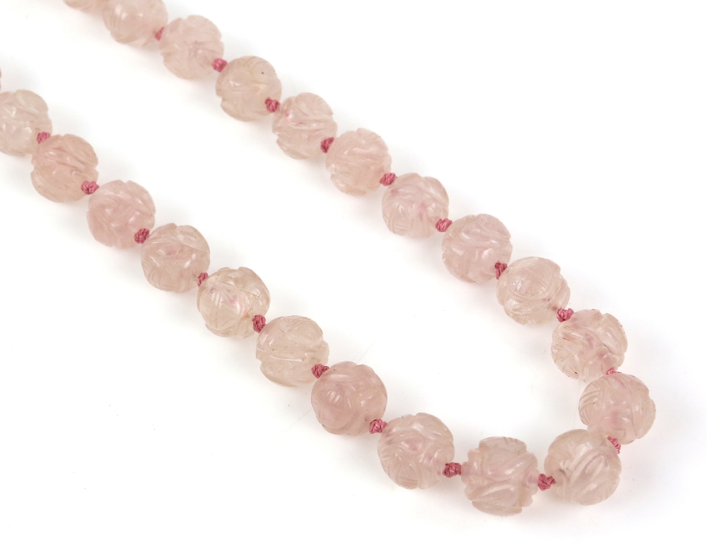 § A rose-quartz necklace with 35 beads, about 52 cm long; together with a white-metal mounted rose- - Image 3 of 8