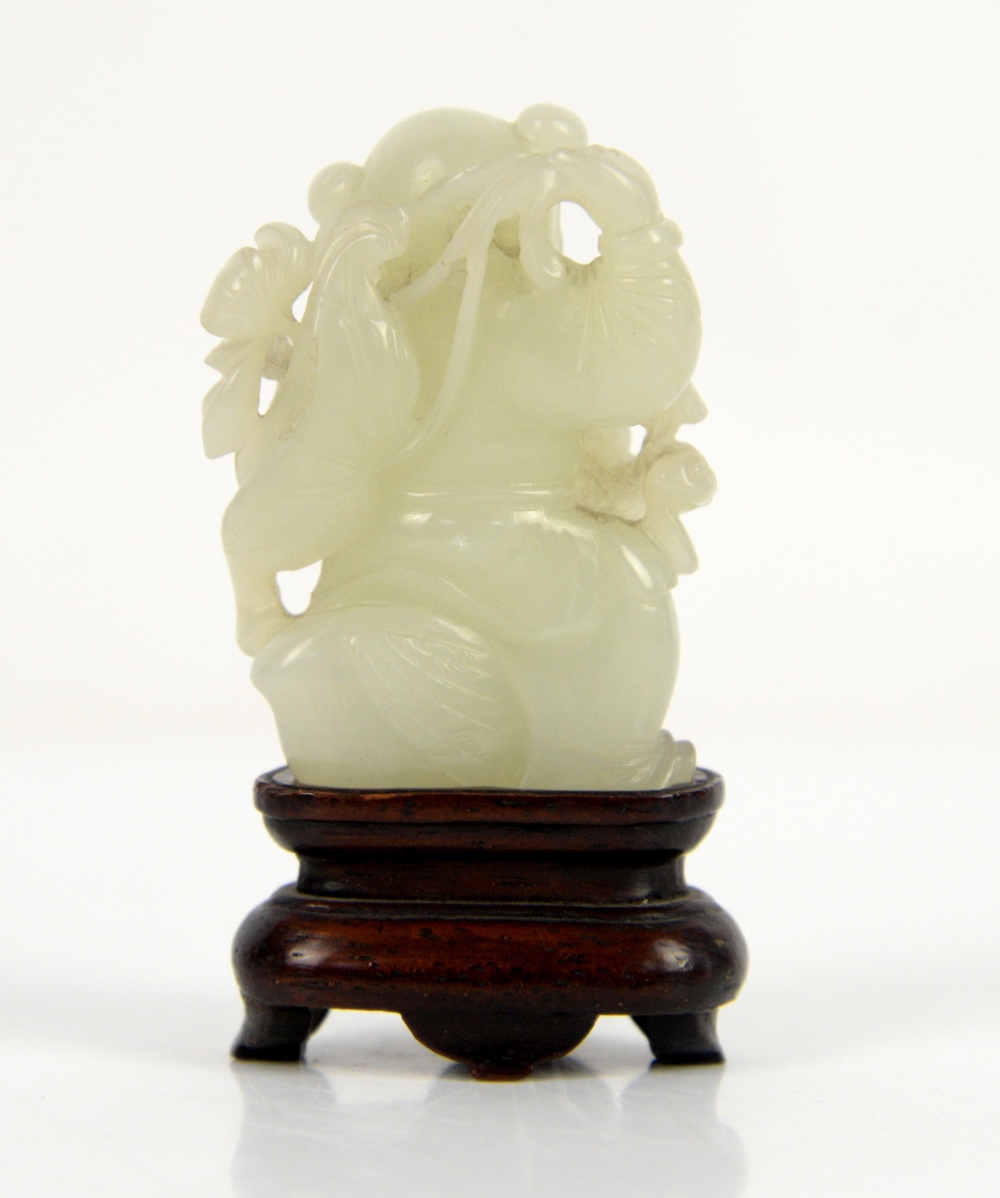 A small Chinese green jade figure of a boy standing beside a duck; about 5 cm high; with a wood - Image 2 of 7