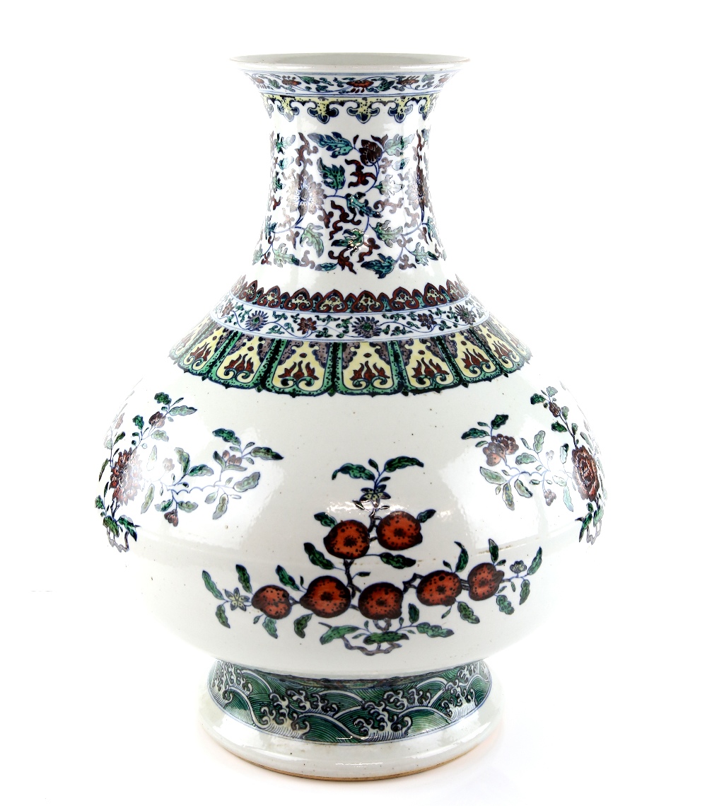 A large doucai style vase with trumpet neck, decorated with floral designs beneath a band of - Image 2 of 11