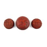 Three Chinese red lacquer boxes; each one of circular form with domed cover; the largest 12 cm