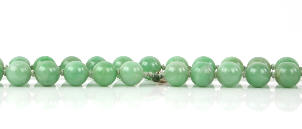 A mottled jadeite or jadeite style necklace mounted with about 85 spherical beads; together with a - Image 5 of 9