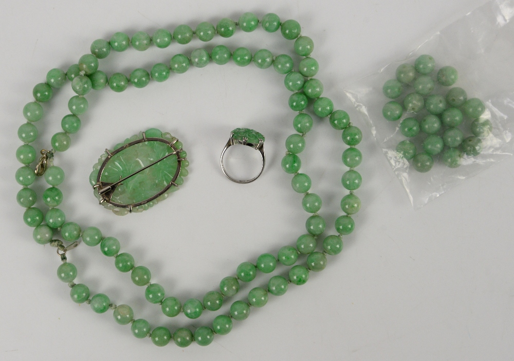 A mottled jadeite or jadeite style necklace mounted with about 85 spherical beads; together with a - Image 2 of 9