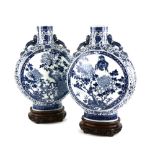 A large pair of blue and white pilgrim-shaped vases; each one decorated with bold designs of Birds