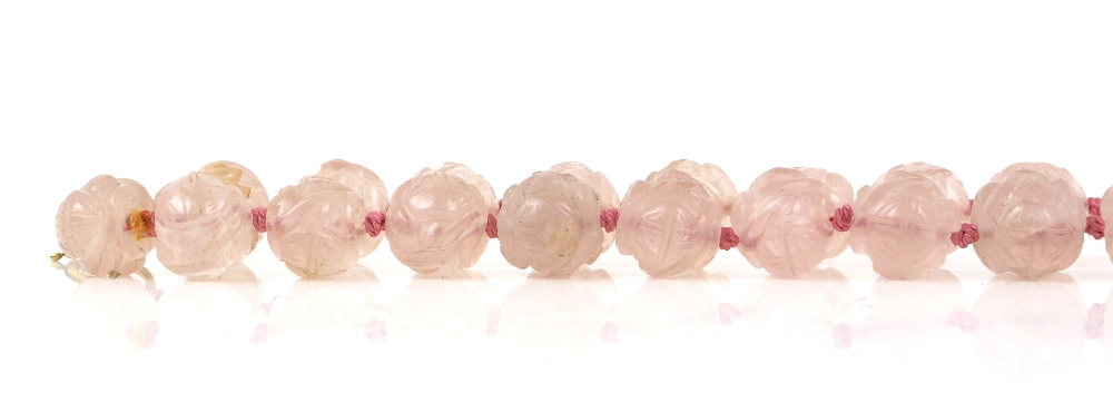 § A rose-quartz necklace with 35 beads, about 52 cm long; together with a white-metal mounted rose- - Image 5 of 8