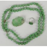 A mottled jadeite or jadeite style necklace mounted with about 85 spherical beads; together with a