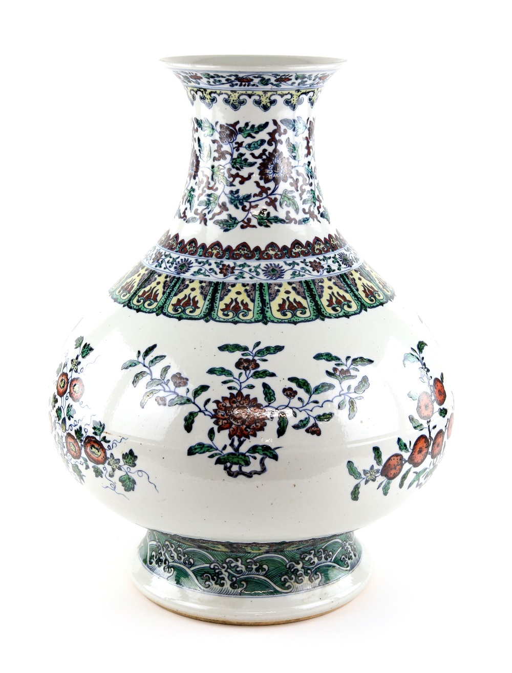 A large doucai style vase with trumpet neck, decorated with floral designs beneath a band of