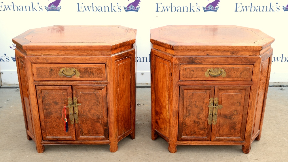 A pair of Chinese wood cabinets; each one approximately 62 x 49 x 51 cm, and of Eight-sided form