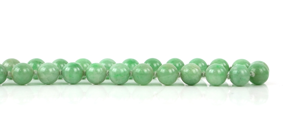 A mottled jadeite or jadeite style necklace mounted with about 85 spherical beads; together with a - Image 4 of 9