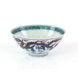 An underglaze blue and doucai style decorated bowl, designed with five clawed dragons on the