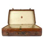 An elegant leather suitcase by Allen of 37 The Strand [maker's label in the interior lid], 61.5 x 36