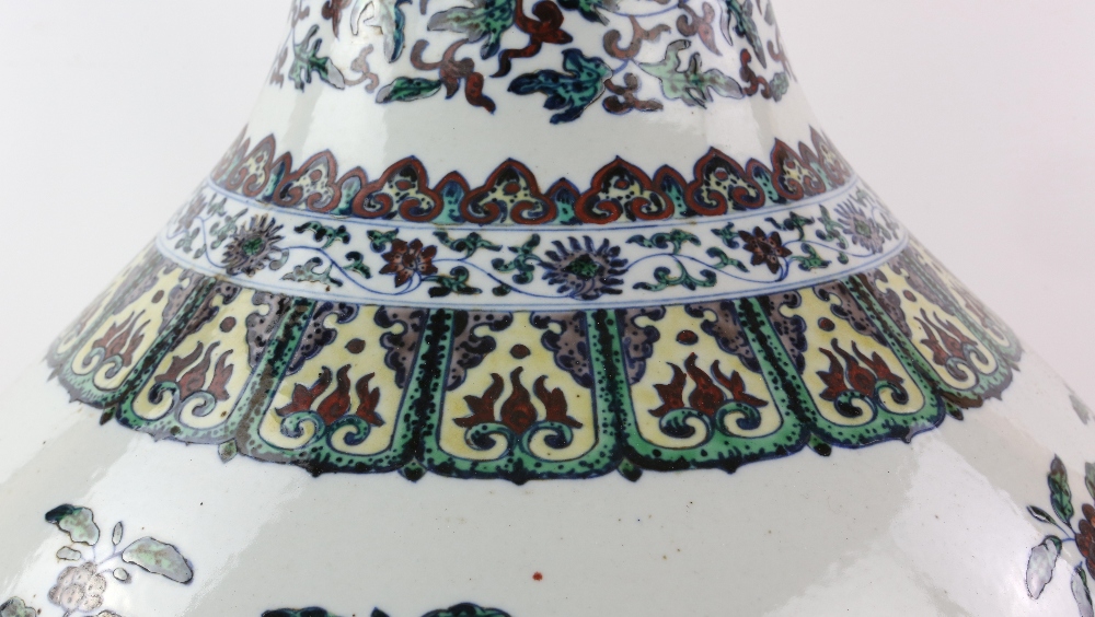 A large doucai style vase with trumpet neck, decorated with floral designs beneath a band of - Image 10 of 11
