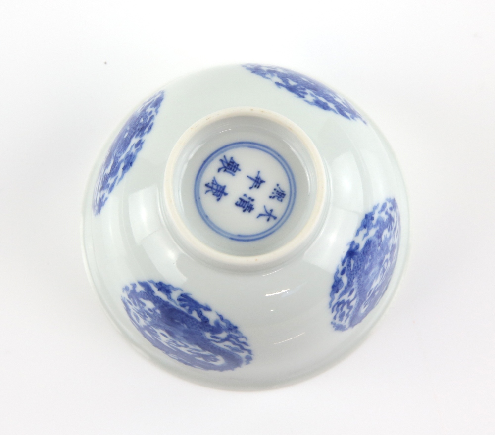 A blue and white bowl, decorated in the well with a coiled dragon roundel; the exterior with four - Image 3 of 4