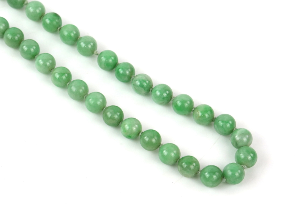 A mottled jadeite or jadeite style necklace mounted with about 85 spherical beads; together with a - Image 3 of 9