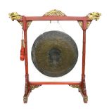 A large Chinese Gong on fitted stand; diameter of the gong about 70 cm; inscribed 'Chang men Zhong