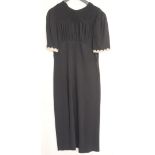 Black short sleeved crepe day dress with white cuffs 1940s