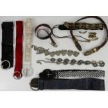 A collection of 10 vintage belts including an Indian embroidered belt and belts in a variety of