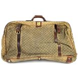 A vintage Gucci travel suitcase - The suitcase with original leather strapping, patterned fabric