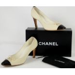 Classic Chanel high heel shoes in cream canvas with leather toe caps and stitched logo, with box ,