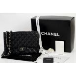 Black Chanel caviar leather classic jumbo flap bag with silver hardware, authenticity card number