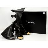 Iconic “cut out” black Chanel leather knee high boots with cream toe caps and 4 buckles at back of