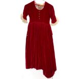 Vintage fashion to include a scarlet red velvet cloak, a black velvet cloak, Frank Usher style