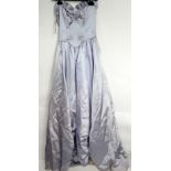 A collection of vintage clothing from 50s to 80s including adult and children's party dresses,